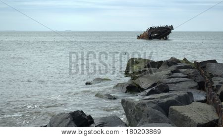 Sunken Concrete Ship Cape May NJ.  This was an experimental ship during World War I.  As seen here, it was a failure and sunk off the coast during a storm.  The ship could not be retrieved.  