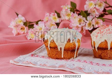 Easter cake with branches of willow on a pink table. Close-up
