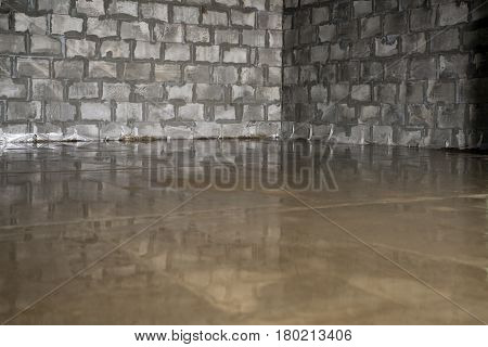 Raw cement screed on the floor with a layer of concrete shot in studio being repaired