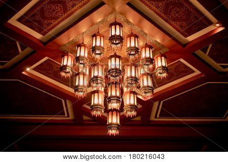 Antique chandeliers on the ceiling in the night life.