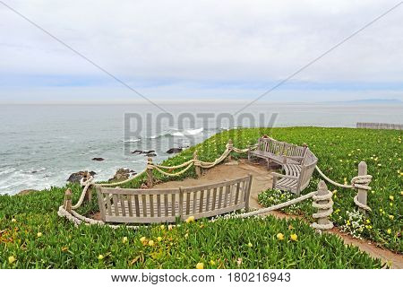 Benches facing the Pacific Ocean at Point Montara Fog Signal and Light Station State Park off of Highway 1 approximately 25 miles south of San Francisco California