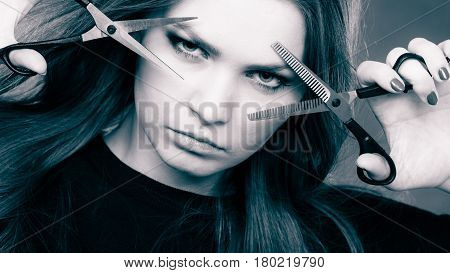 Elegance and classy. Fashion style of hairdo. Female professionalist with scissors. Elegant woman presents her hairdresser's saloon.