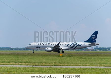 SCHIPHOL NETHERLANDS - JUNE 4 2016: A KLM Skyteam plane takes off at amsterdam international airport. SkyTeam is an alliance between different global airlines