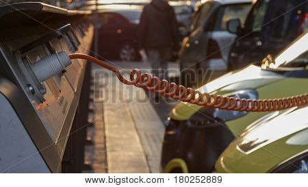 Power supply for electric car charging. City electric car charging station. Close-up.