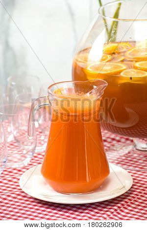 Fresh juice on a table in a restaurant. Healthy drinks. carrot fresh in a jar.
