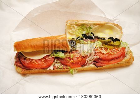 Large Takeout Grinder/Sub Sandwich on Paper Background