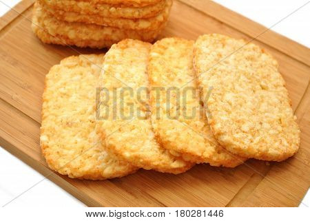 Frozen Potato Hash Browns on a Wooden Cutting Board