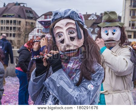 BASEL SWITZERLAND - MARCH 08 : Participants in the Basel Carnival in Basel Switzerland on March 08 2017. The Basel carnival has been listed as one of the top local festivities in Europe
