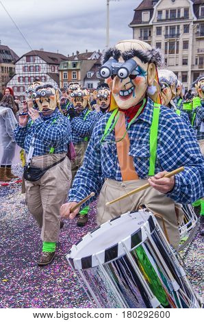 BASEL SWITZERLAND - MARCH 08 : Participants in the Basel Carnival in Basel Switzerland on March 08 2017. The Basel carnival has been listed as one of the top local festivities in Europe