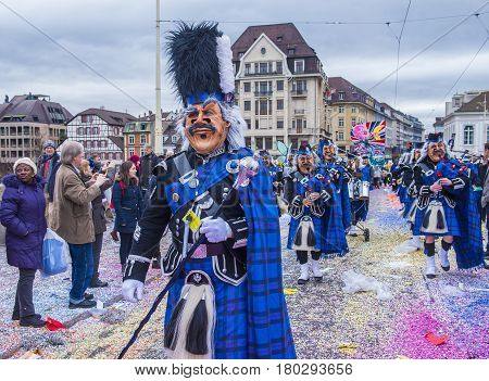 BASEL SWITZERLAND - MARCH 08 : Participants in the Basel Carnival in Basel Switzerland on March 08 2017. The Basel carnival has been listed as one of the top local festivities in Europe
