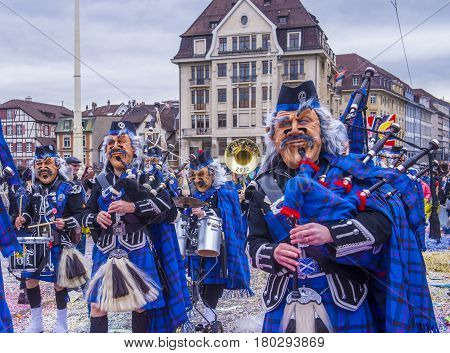 BASEL SWITZERLAND - MARCH 08 : Participants in the Basel Carnival in Basel Switzerland on March 08 2017. The Basel carnival has been listed as one of the top local festivities in Europe