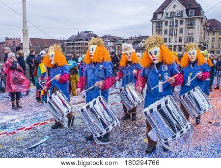 BASEL SWITZERLAND - MARCH 08 : Participants in the Basel Carnival in Basel Switzerland on March 08 2017. The Basel carnival has been listed as one of the top local festivities in Europe
