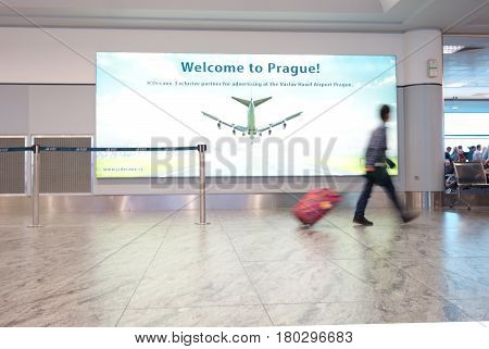 PRAGUECZECH REPUBLIC - 10-03-2016: A man walks down the concourse at Vaclav Havel International Airport in Prague