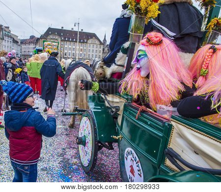 BASEL SWITZERLAND - MARCH 08 : Participants in the Basel Carnival in Basel Switzerland on March 08 2017. The Basel carnival has been listed as one of the top local festivities in Europe