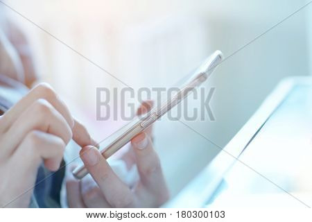 man tapping on smartphone to search for information