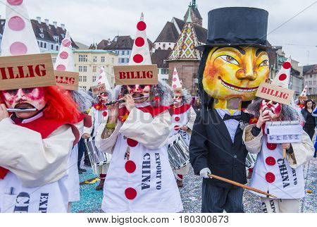 BASEL SWITZERLAND - MARCH 08 : Participants in the Basel Carnival in Basel Switzerland on March 08 2017. The Basel carnival has been listed as one of the top local festivities in Europe