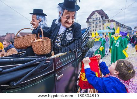 BASEL SWITZERLAND - MARCH 08 : Participants in the Basel Carnival in Basel Switzerland on March 08 2017. The Basel carnival has been listed as one of the top local festivities in Europe