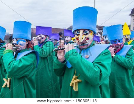 BASEL SWITZERLAND - MARCH 08 : Participants in the Basel Carnival in Basel Switzerland on March 08 2017. The Basel carnival has been listed as one of the top local festivities in Europe