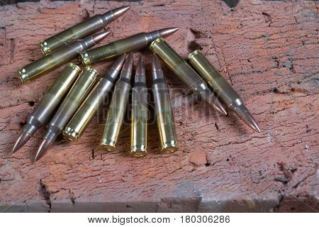Group of  ammunition on a  bricks background
