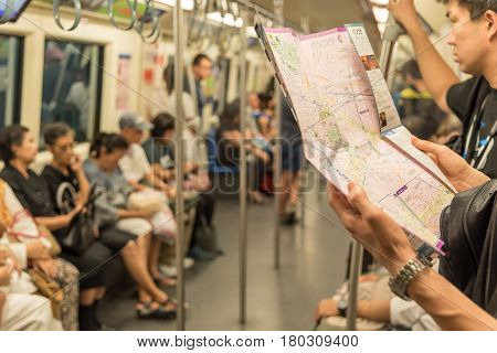 Mrt Subway Train, Tourist Looks Location On Map