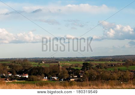 English Village Viewed From A Countryside Filed