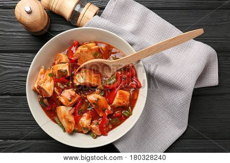 Plate with chicken cacciatore on kitchen table