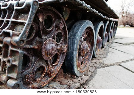 Detail Shot With Old Vintage Tank Tracks And Wheels.