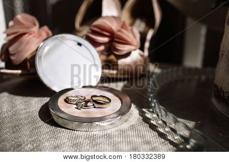Wedding rings a bouquet of lavender and beige bridesmaid shoes