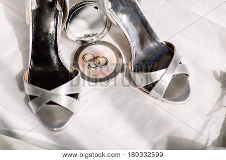Wedding rings a bouquet of lavender and beige bridesmaid shoes