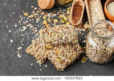Healthy Snack - Crispy Cereal Cookies On Black Stone Table And Ingredients: Oat Flakes, Flax Seed, P