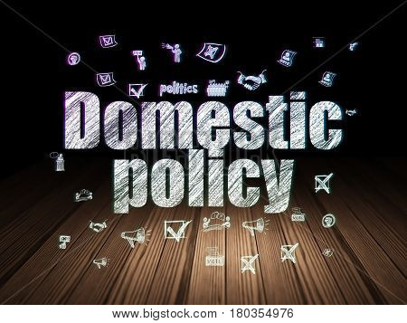 Politics concept: Glowing text Domestic Policy,  Hand Drawn Politics Icons in grunge dark room with Wooden Floor, black background