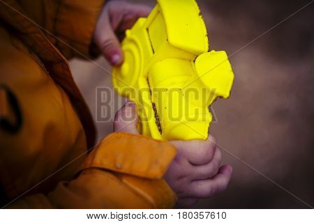 Yellow Locomotive Sand Form In Boys Hands