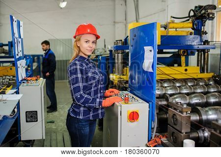 Woman In Red Safety Helmet Work As Industrial Worker