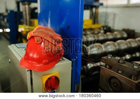 Gloves On Red Safety Helmet In Factory