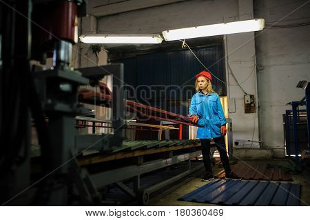 Woman In Red Safety Helmet Work As Industrial Worker