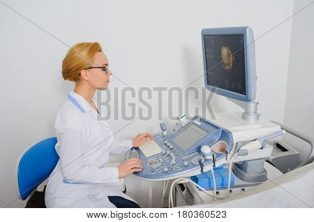 Doctor Analyze The Result Of Ultrasound Diagnostic Machine