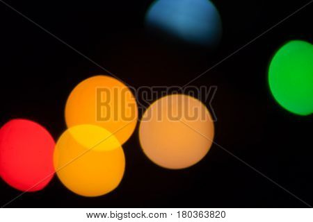 Photo of circular multicolor bokeh lights on black background