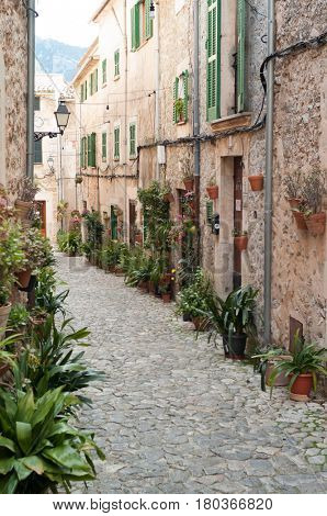 VALLDEMOSSA, SPAIN - MARCH, 2017: Idyllic street scene in Valldemossa on Mallorca island