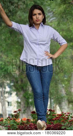 A Serious Unhappy Female  Standing in Park