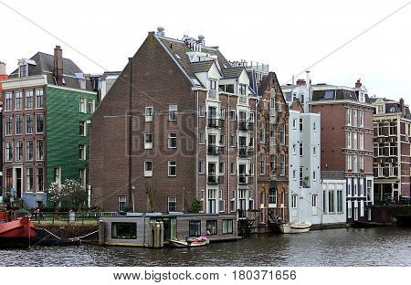 Amsterdam in April, 2016. Netherlands. Amsterdam cityscape with houseboats.