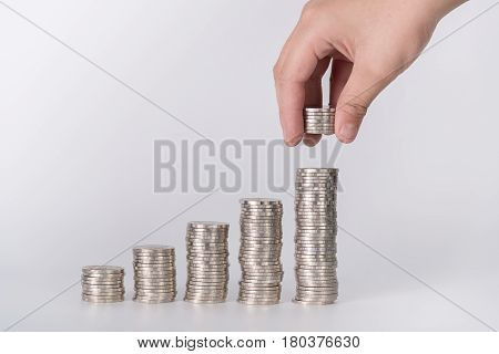Hand Put Money Coins To Stack Of Coins, Money, Financial, Business Growth And Saving Money Concept.