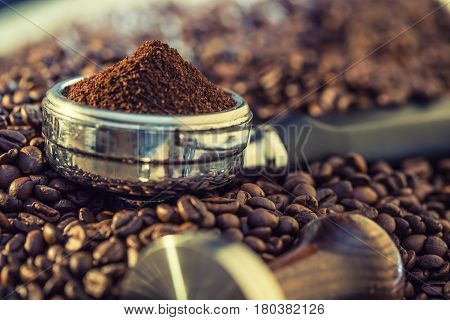 Coffee.Coffee beans. Coffee beans and portafilter. Toned image.