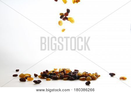 Raisin / A raisin is a dried grape. Raisins are produced in many regions of the world and may be eaten raw or used in cooking, baking, and brewing