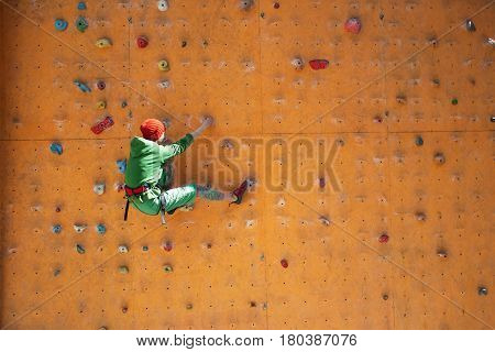 The Girl Climbs On The Climbing Wall.