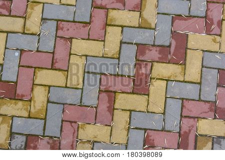 Texture of road surface made of multicolor pave stones