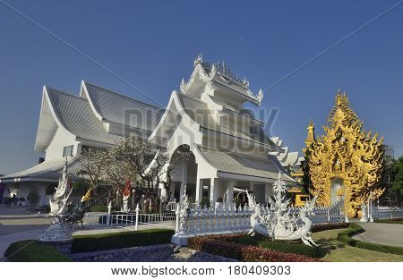 Wat Rong Khun the White Temple art exhibit in the style of a Buddhist temple in Chiang Rai Province north Thailand.