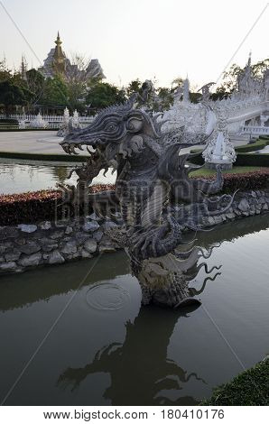 Wat Rong Khun the White Temple art exhibit in the style of a Buddhist temple in Chiang Rai Province north Thailand.