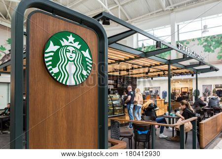 Samara Russia - April 1 2017: Starbucks cafe interior in Samara shopping center Kosmoport. Starbucks Corporation is an American global coffee company and coffeehouse chain