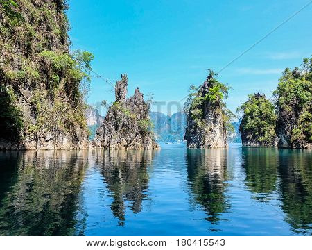Three Moutains Island With Green Tree And Blue Sky At Ratchaprapa Dam In Thailand, Mirror Or Shadow