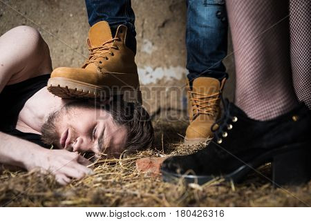Closeup of a mans foot crushing man's head. Homophobic people